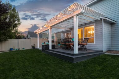 off-white house with white pergola and tan patio furniture in Boise, Idaho.