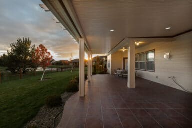 large white patio cover over a dark brown patio in Boise, Idaho.