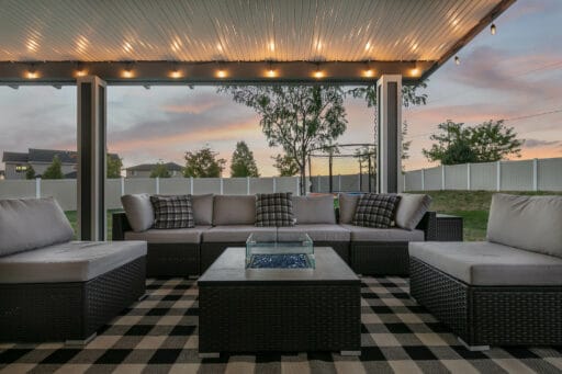 grey and white patio cover with checkered black and white patio furniture in Boise, Idaho.