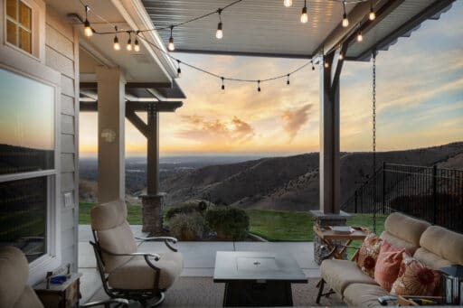tan patio cover and dark brown pergola overlooking foothills in Boise, Idaho.