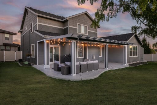 grey and white house with grey patio cover in Boise, Idaho.