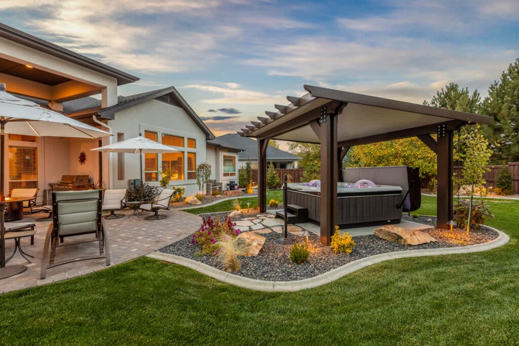 brown and tan detached patio cover over a colorful hot tub in Nampa, Idaho.