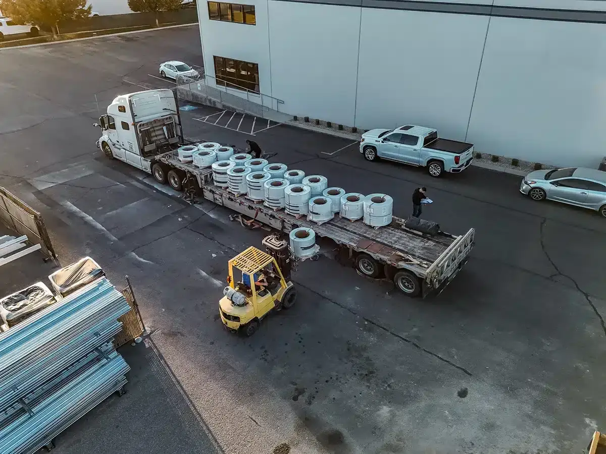 Aluminum material delivery at ShadeWorks facility for custom patio cover and pergola manufacturing