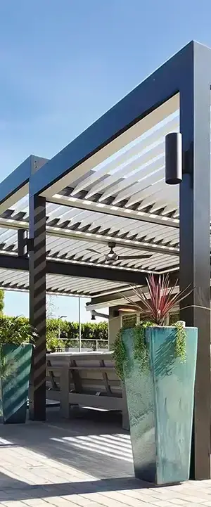 Adjustable louvered roof system allowing flexible sun and weather control for outdoor living in Eastern Idaho