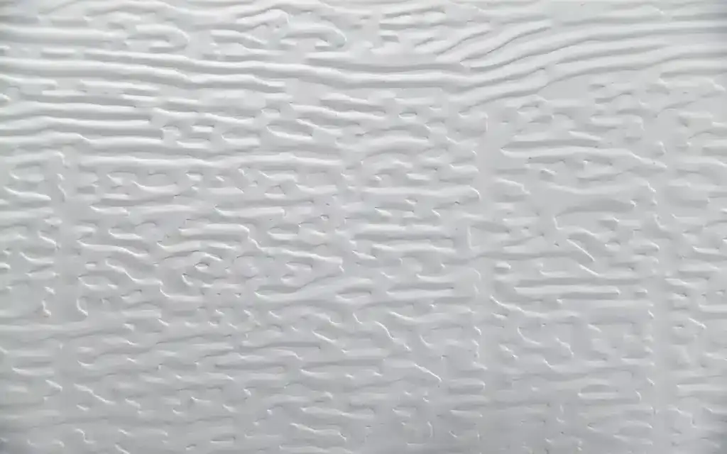 Close-up of embossed aluminum panel texture used in ShadeWorks patio cover systems