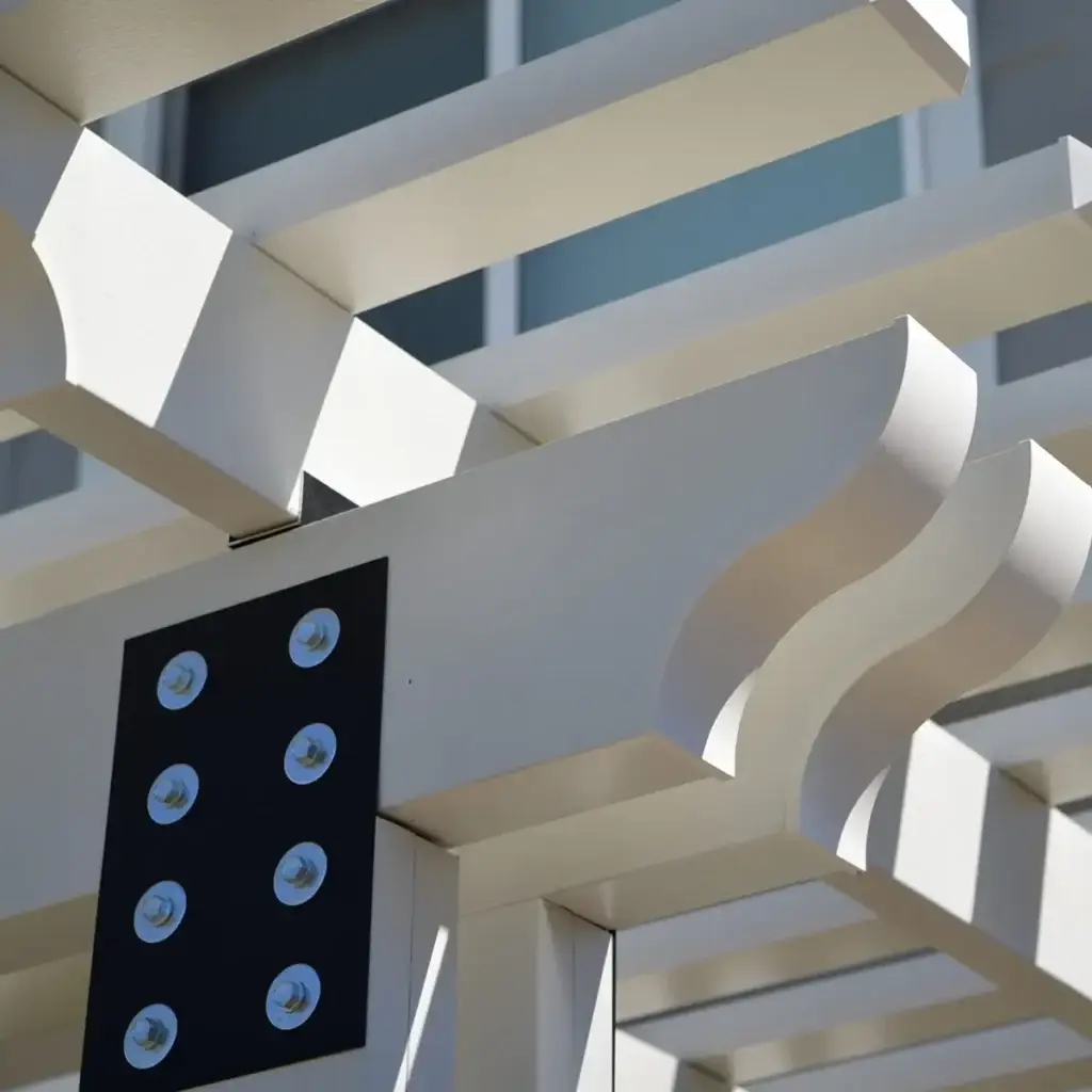 Close-up detail of a white aluminum pergola structure installed by ShadeWorks