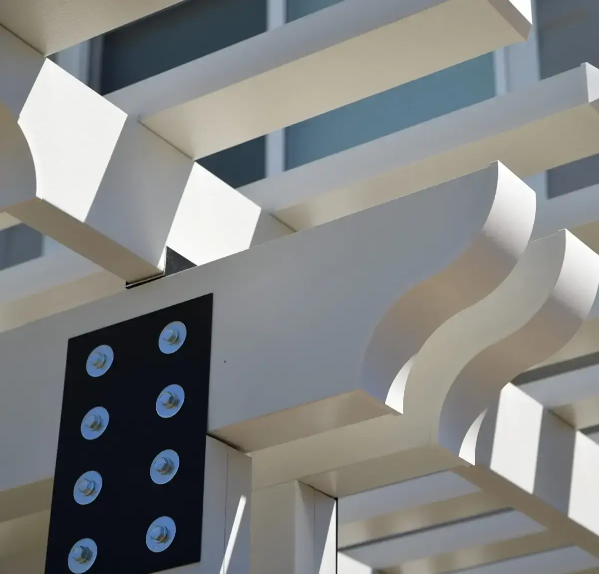 Close-up detail of a white aluminum pergola structure installed by ShadeWorks