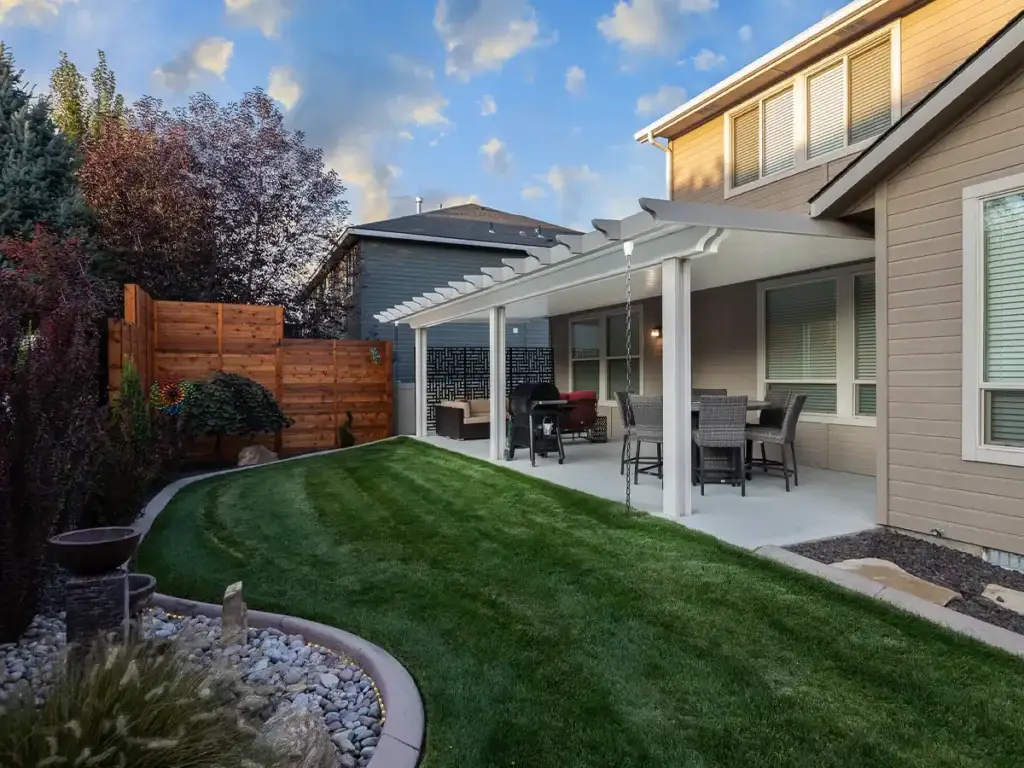 Backyard patio cover providing shade and allowing airflow