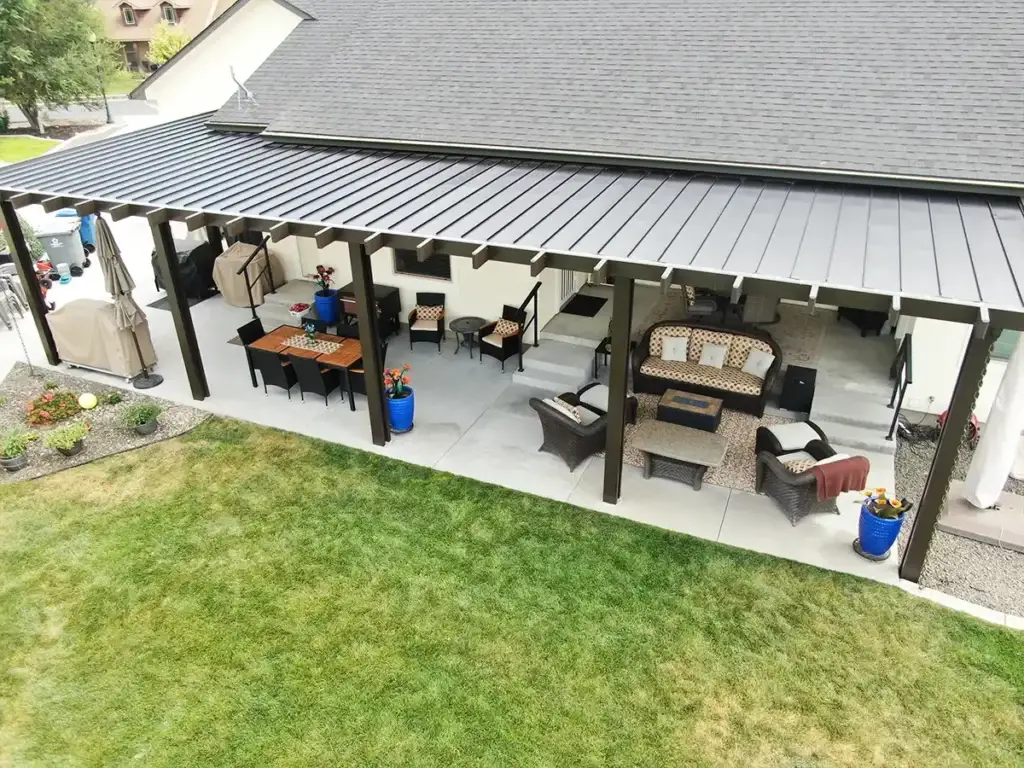Comfortable backyard outdoor living space under a covered patio area