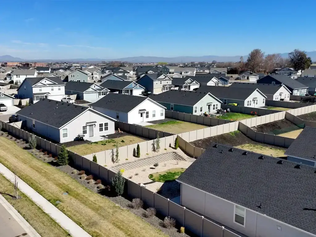 Backyard with no shade showing heat buildup on concrete patio in direct sun