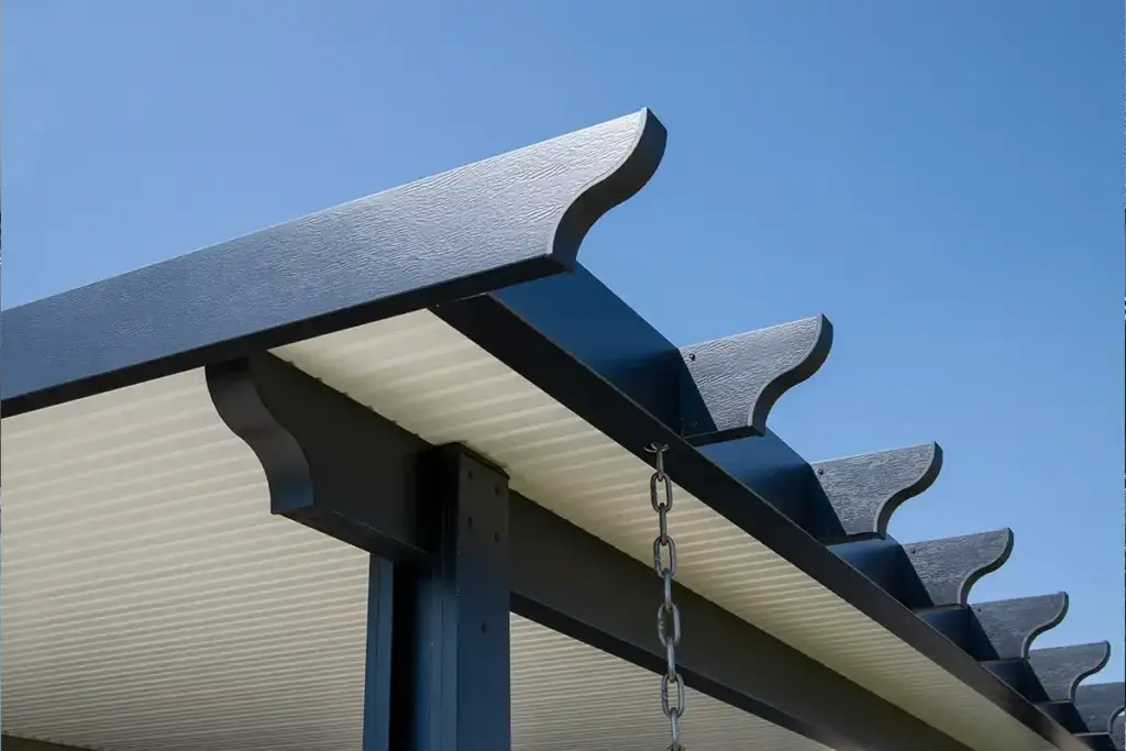 Insulated aluminum patio cover creating full shade for backyard seating area