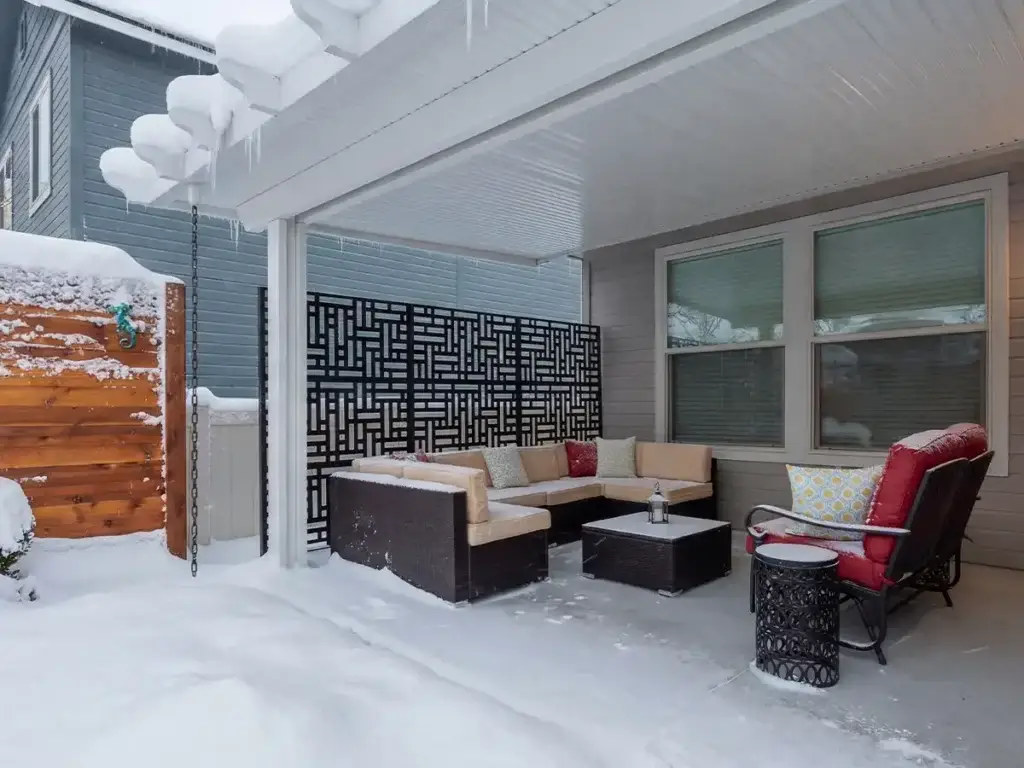 Custom patio cover protecting backyard from snow in Eastern Idaho