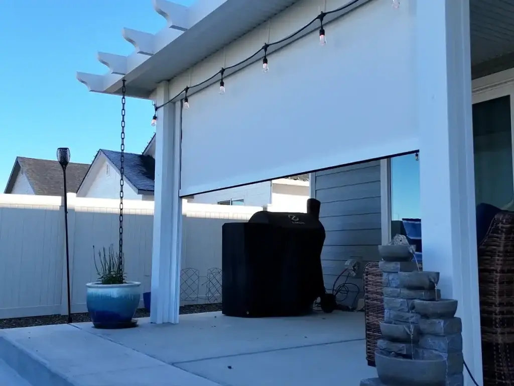 Exterior shade screen helping block low-angle sun and reduce patio glare