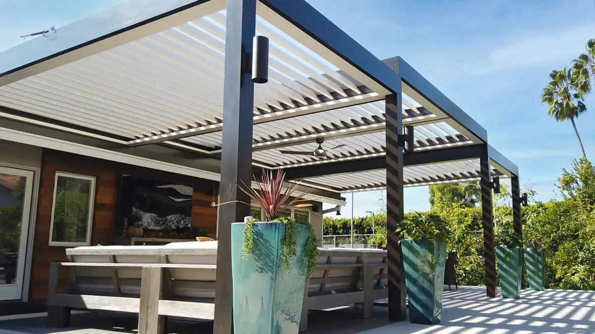 Modern aluminum louvered pergola attached to home with adjustable roof