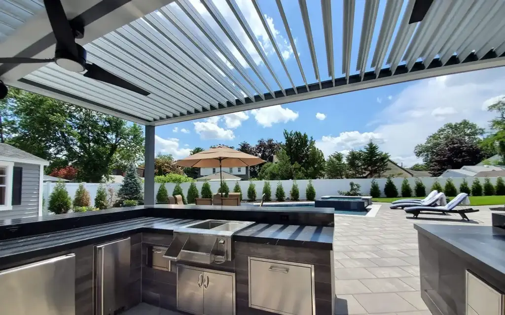 Louvered roof providing shade in private backyard