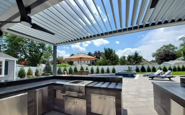 Louvered roof providing shade in private backyard
