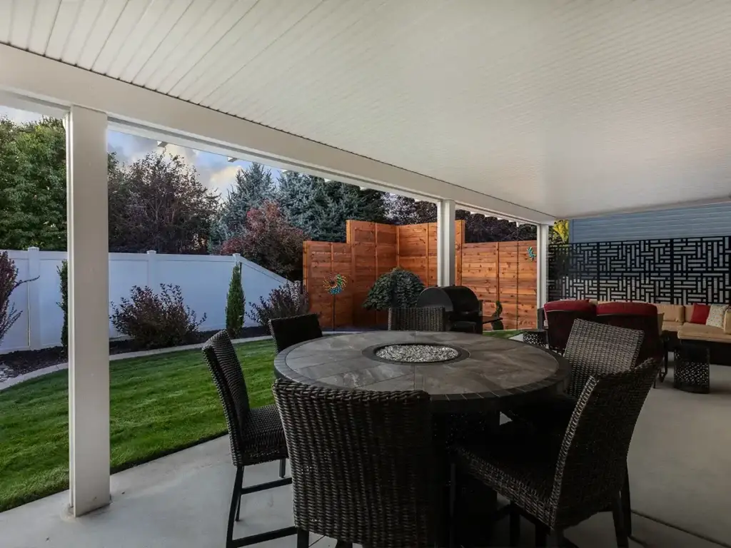 Attached patio cover creating dependable backyard shade for outdoor seating