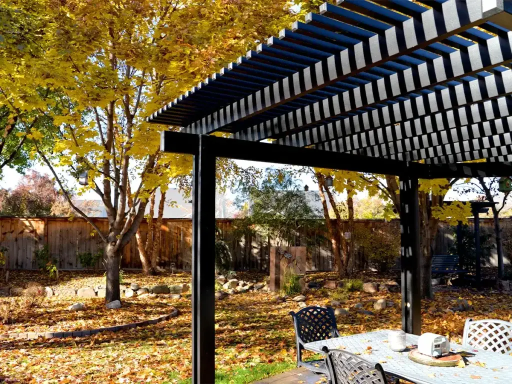 Backyard shade structure helping create a more usable patio during seasonal weather
