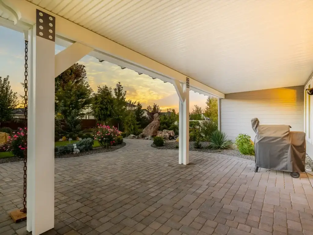 Backyard patio cover that helps turn an outdoor space into a more usable extension of the home