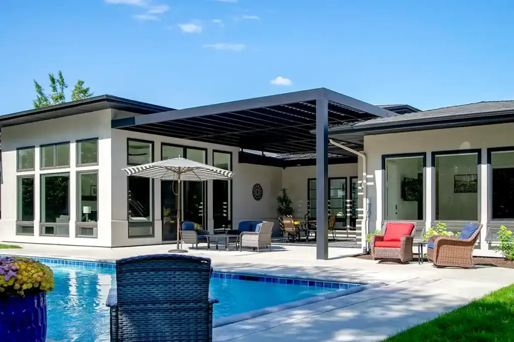 Custom louvered patio cover installed over poolside outdoor living area in Treasure Valley