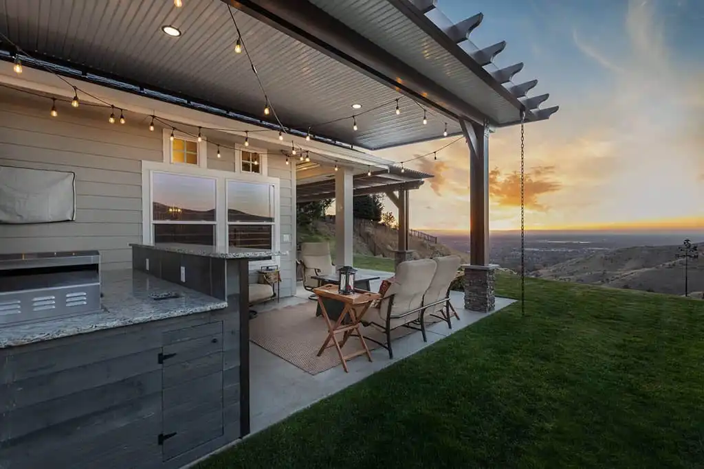 Custom aluminum patio cover with outdoor kitchen and foothills views installed by ShadeWorks in Boise, Idaho.