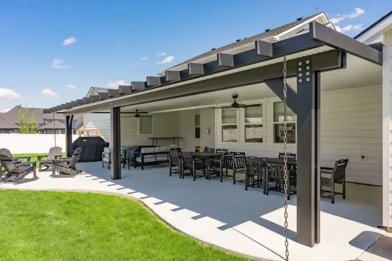 Large black patio cover creating an outdoor entertainment space