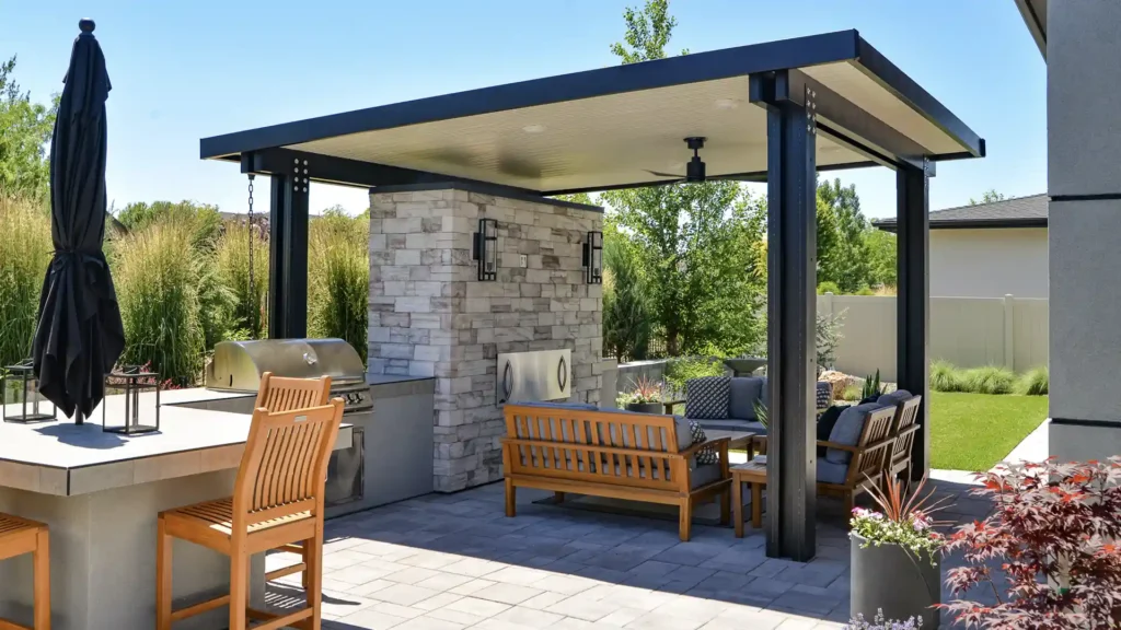 Custom aluminum patio cover creating shade over an outdoor living space in a Las Vegas backyard.