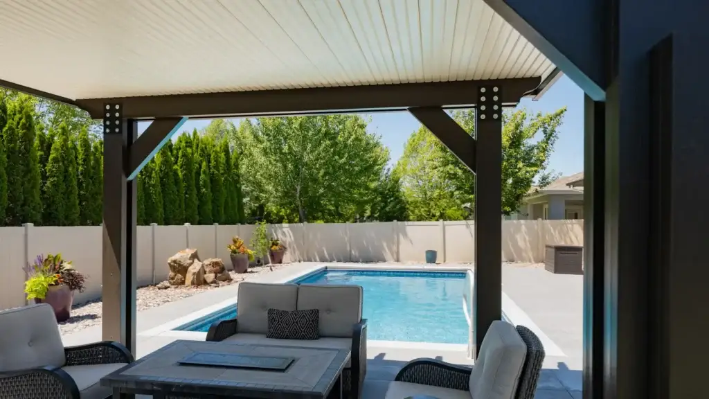 Custom insulated aluminum patio cover overlooking a backyard pool in Las Vegas, Nevada installed by ShadeWorks.