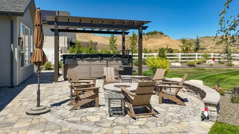 Aluminum pergola installed beside a hot tub and fire pit area