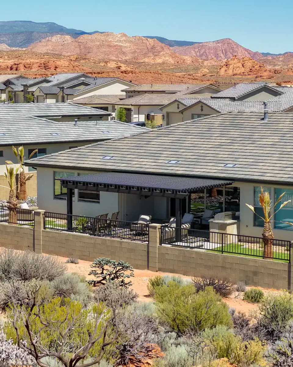 Custom attached pergola overlooking a Southern Utah backyard with red rock mountains in the background