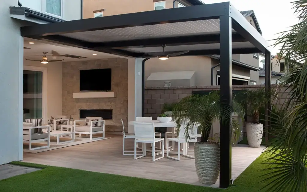 Custom black motorized louvered roof creating a covered outdoor living space in Meridian, Idaho.