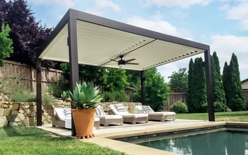 Custom motorized louvered roof system creating adjustable shade over an outdoor seating area in Meridian, Idaho.