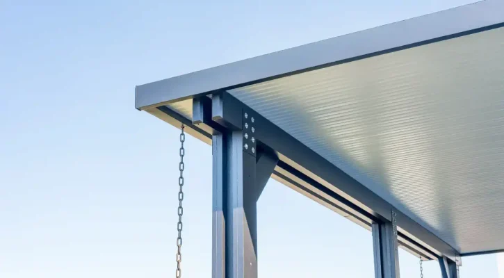 Close-up view of insulated aluminum patio cover structure and outdoor seating area