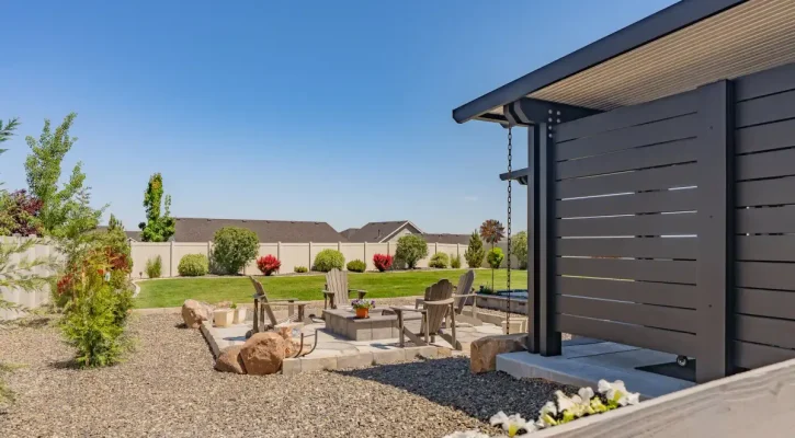 Large backyard patio cover creating shade and outdoor living space in Boise