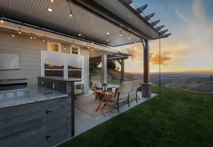 Custom aluminum patio cover with outdoor kitchen and foothills views installed by ShadeWorks in Boise, Idaho.