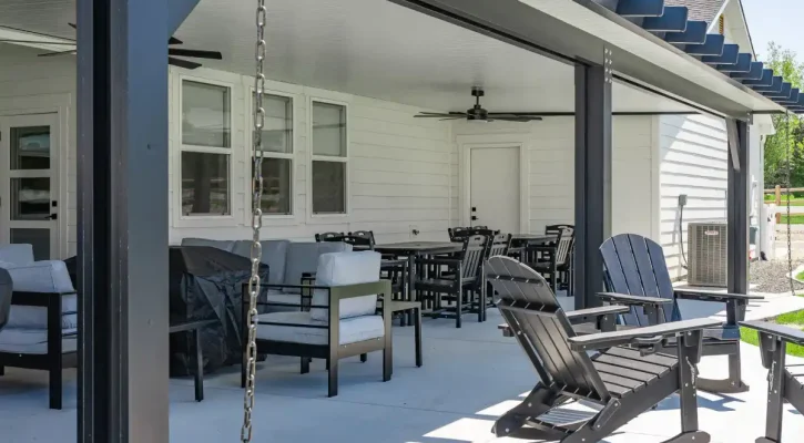 Covered outdoor living area with insulated patio cover and poolside seating in Boise