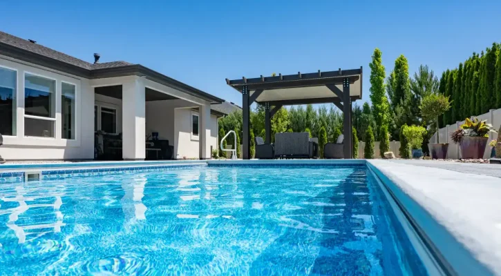 Freestanding insulated patio cover creating a poolside backyard retreat in Boise