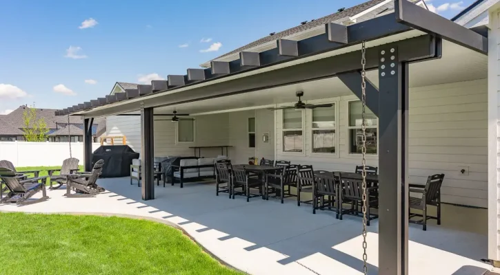 Large black patio cover creating an outdoor entertainment space