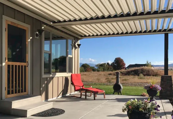 Louvered patio cover providing adjustable backyard shade and sun control