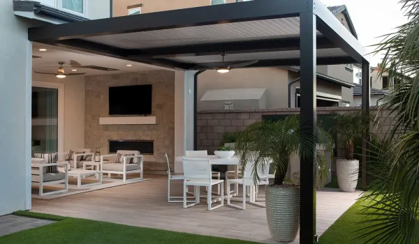 Custom black motorized louvered roof creating a covered outdoor living space in Meridian, Idaho.