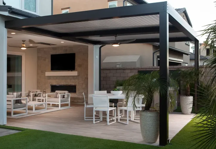 Custom black motorized louvered roof creating a covered outdoor living space in Meridian, Idaho.