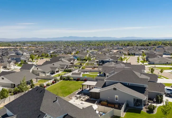 Aerial view of custom patio cover installation in a residential neighborhood