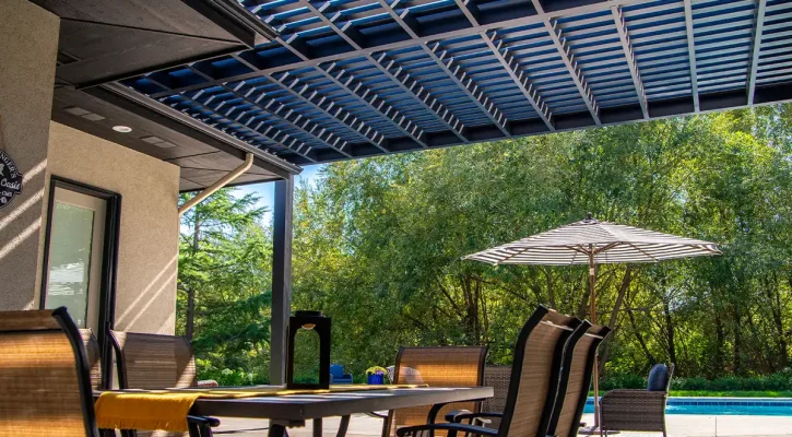 Pergola providing filtered shade and structure in a backyard living area