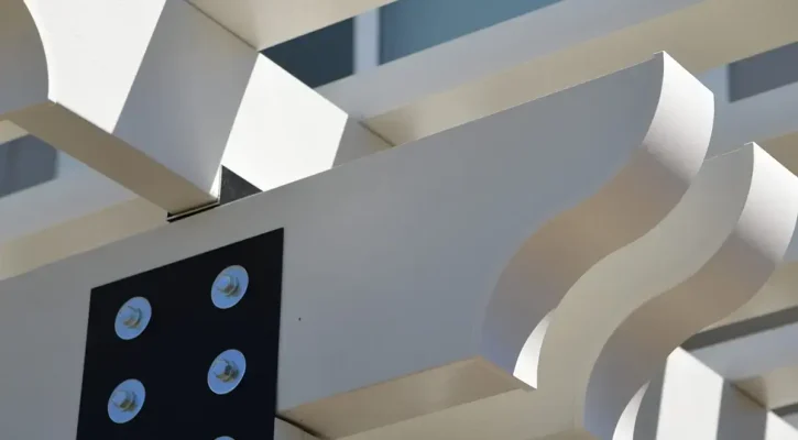 Close-up detail of a white aluminum pergola structure installed by ShadeWorks