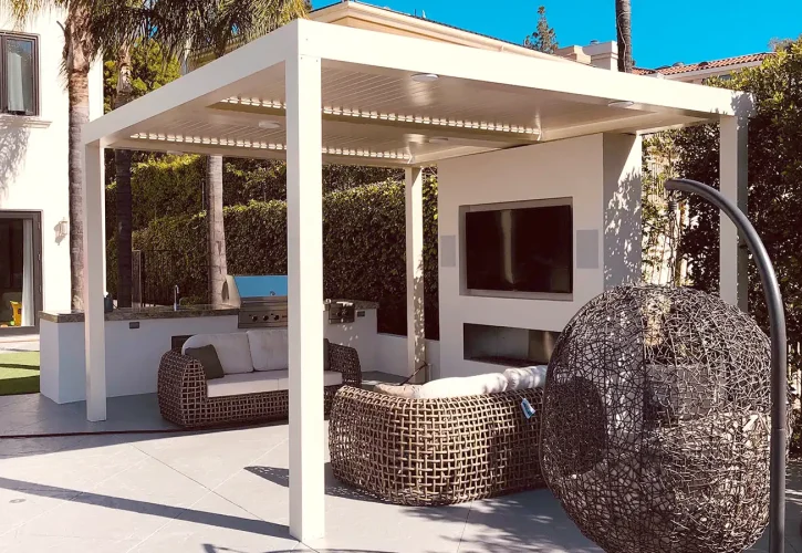 Custom white louvered patio cover over an outdoor living space in St. George, Utah installed by ShadeWorks.