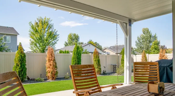White insulated patio cover covering an outdoor dining area